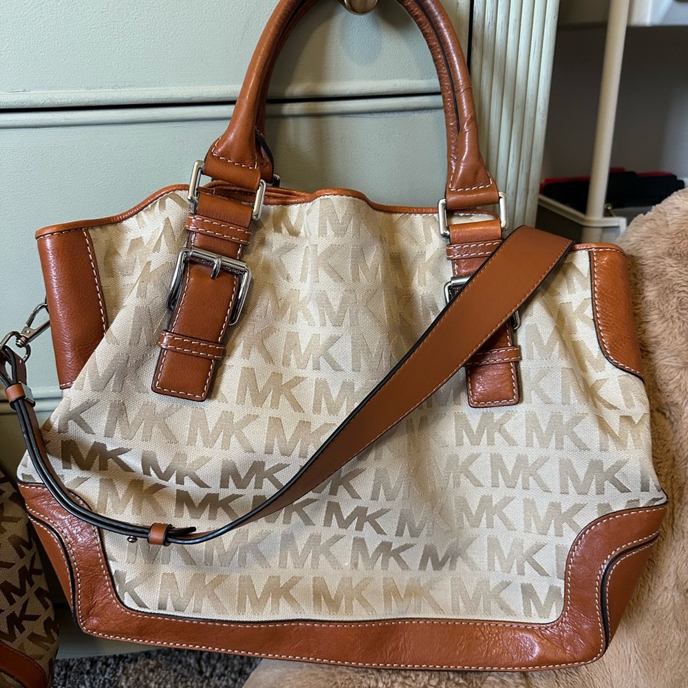 Authentic Micheal Kors Brookville canvas monogram and leather satchel.